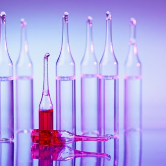 Ampules shallow depth of field macro still life on blue purple